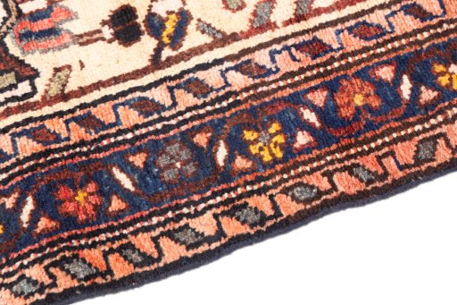 Backside of handmade 1973s Hamedan rug showing knot structure and weave density
