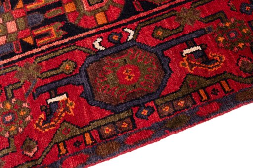 Backside of handmade 1975s Hamedan rug showing knot structure and weave density