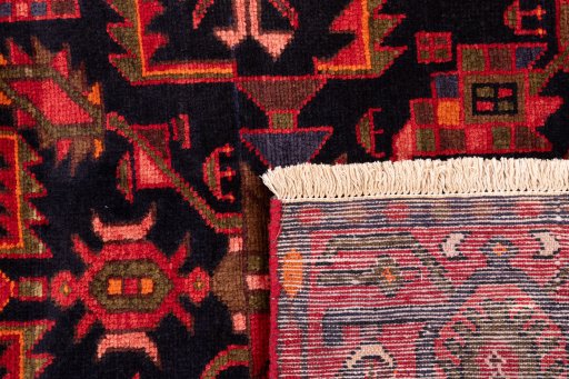 Close-up detail of 1975s Hamedan rug from Iran / Persia showing Wool weave