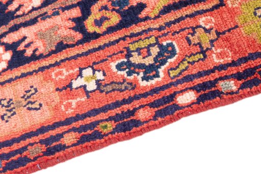 Backside of handmade 1997s Hamedan rug showing knot structure and weave density