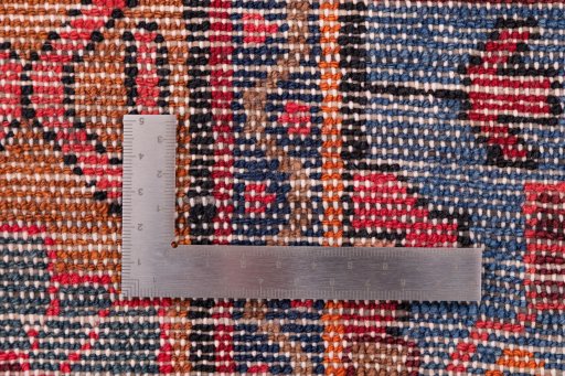 Corner detail of 1975s Hamedan rug showing border pattern and Wool pile
