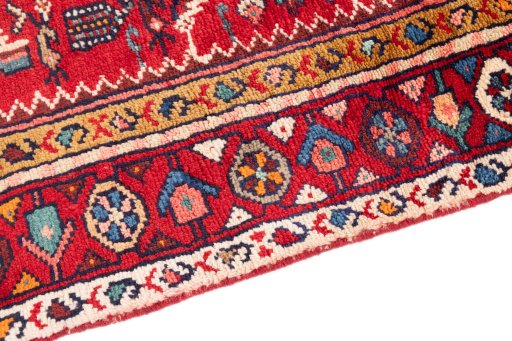 Backside of handmade 1982s Hamedan rug showing knot structure and weave density