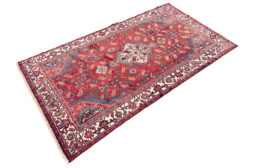 Corner detail of 1975s Hamedan rug showing border pattern and Wool pile