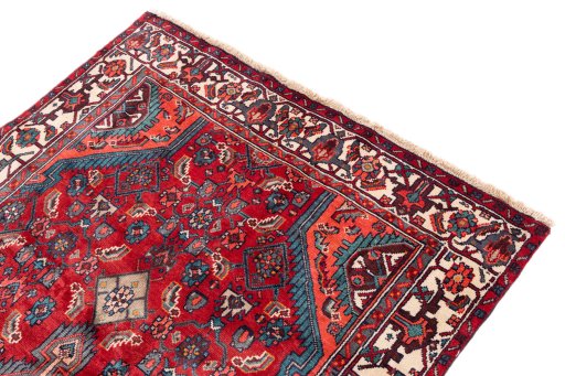 Surface texture of 1975s Hamedan rug with natural Wool and intricate pattern