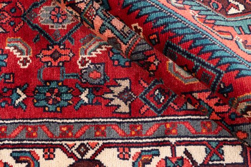 Corner detail of 1975s Hamedan rug showing border pattern and Wool pile