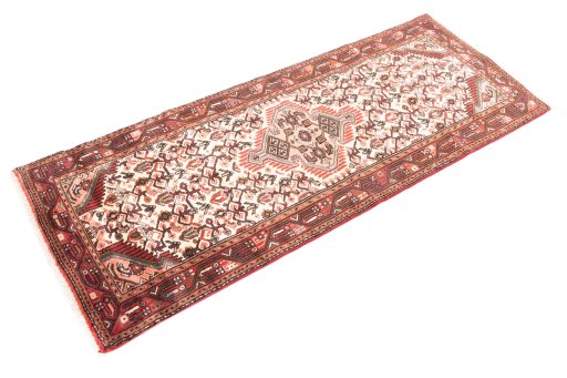 Corner detail of 2000s Hamedan rug showing border pattern and Wool pile