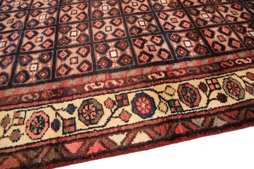 Backside of handmade 1990s Hamedan rug showing knot structure and weave density