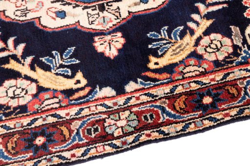 Backside of handmade 1984s Hamedan rug showing knot structure and weave density