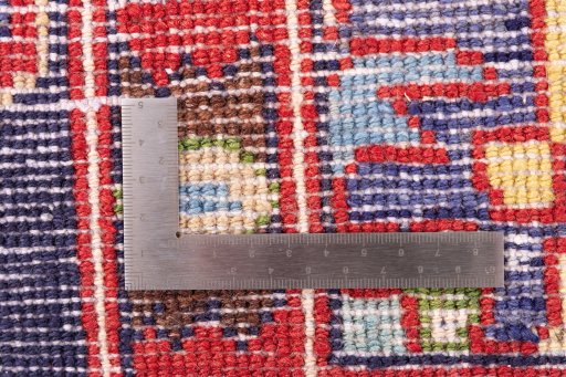Surface texture of 2000s Hamedan rug with natural Wool and intricate pattern