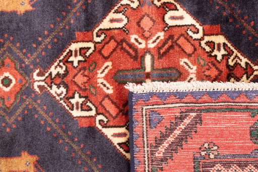 Close-up detail of 1971s Hamedan rug from Iran / Persia showing Wool weave
