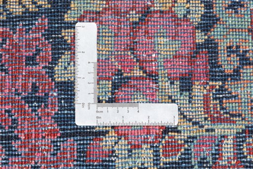 Backside of handmade 2002s Hamedan rug showing knot structure and weave density