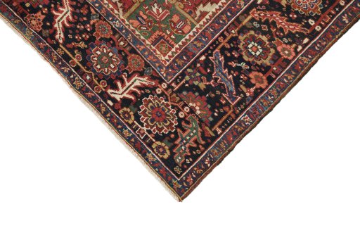 Backside of handmade 1940s Heriz rug showing knot structure and weave density