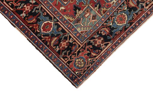 Backside of handmade 1940s Heriz rug showing knot structure and weave density