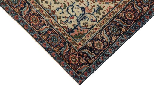 Backside of handmade 1920s Heriz rug showing knot structure and weave density