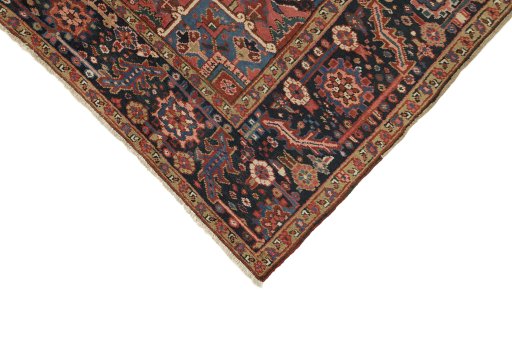 Backside of handmade 1930s Heriz rug showing knot structure and weave density