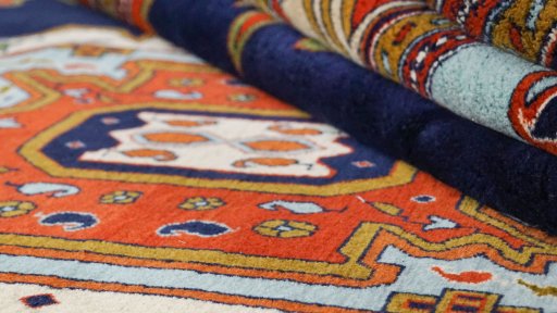 Corner detail of 1990s Heriz rug showing border pattern and Wool pile