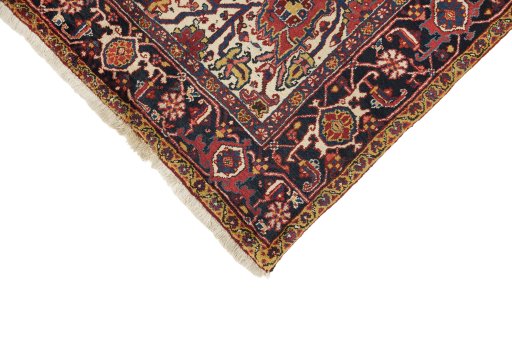 Backside of handmade 1940s Heriz rug showing knot structure and weave density