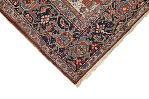 Backside of handmade 1920s Heriz rug showing knot structure and weave density