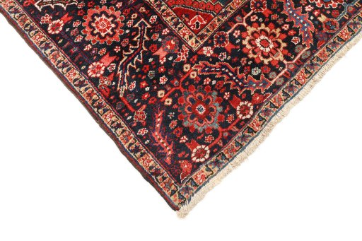 Backside of handmade 1940s Heriz rug showing knot structure and weave density