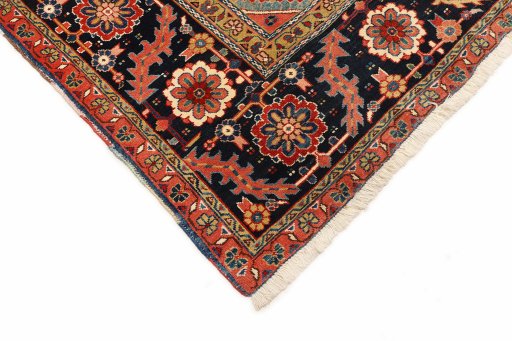 Backside of handmade 1990s Heriz rug showing knot structure and weave density