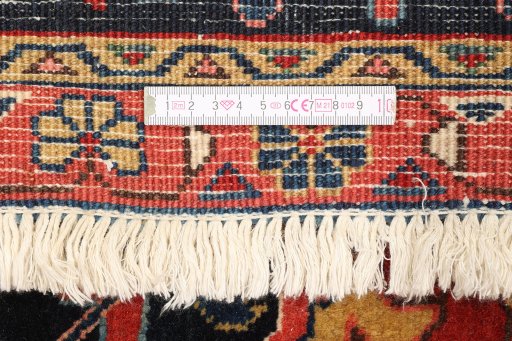 Full view of 1990s Heriz rug from Iran / Persia, 452 × 335 cm in Red tones