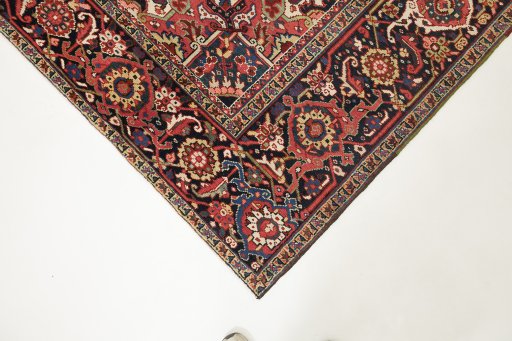 Backside of handmade 1940s Heriz rug showing knot structure and weave density