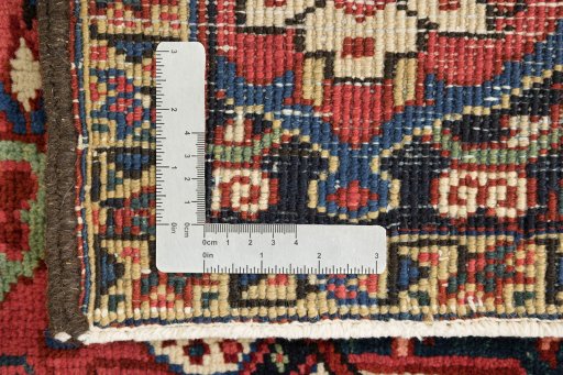 Full view of 1940s Heriz rug from Iran / Persia, 420 × 297 cm in Dark red tones