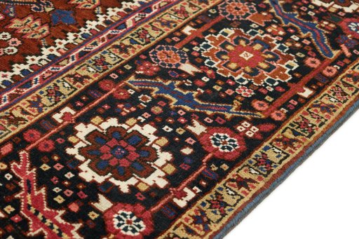 Backside of handmade 1940s Heriz rug showing knot structure and weave density