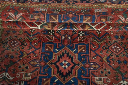 Corner detail of 1930s Heriz rug showing border pattern and Wool pile