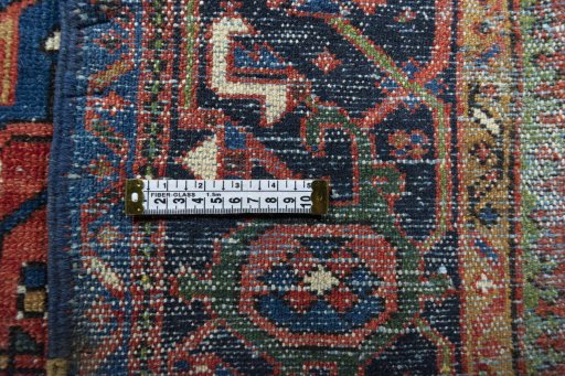 Surface texture of 1930s Heriz rug with natural Wool and intricate pattern