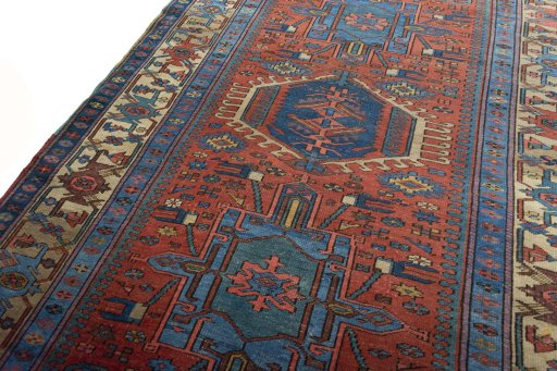 Backside of handmade 1930s Heriz rug showing knot structure and weave density