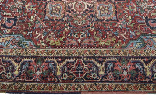 Corner detail of 1930s Heriz rug showing border pattern and Wool pile