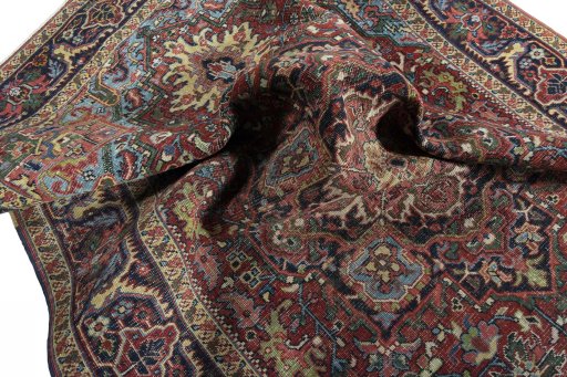 Surface texture of 1930s Heriz rug with natural Wool and intricate pattern