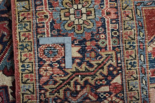 Backside of handmade 1930s Heriz rug showing knot structure and weave density