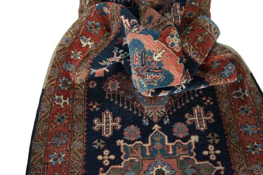 Corner detail of 1930s Heriz rug showing border pattern and Wool pile