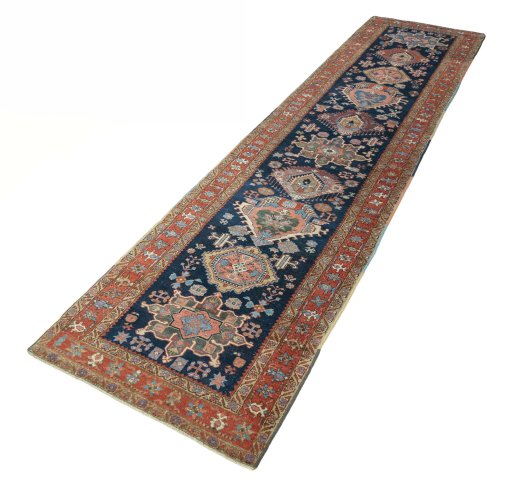 Corner detail of 1930s Heriz rug showing border pattern and Wool pile