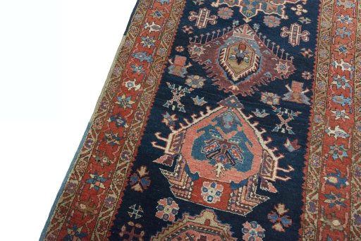 Backside of handmade 1930s Heriz rug showing knot structure and weave density