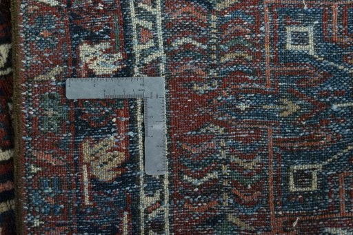 Close-up detail of 1930s Heriz rug from Iran / Persia showing Wool weave