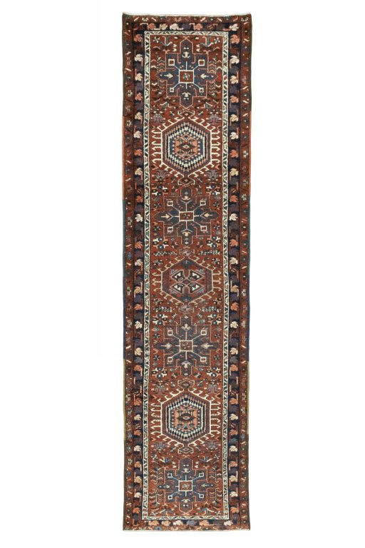 Full view of 1930s Heriz rug from Iran / Persia, 319 × 81 cm in Red tones