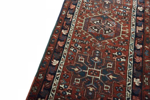 Backside of handmade 1930s Heriz rug showing knot structure and weave density