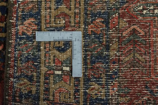 Surface texture of 1930s Heriz rug with natural Wool and intricate pattern