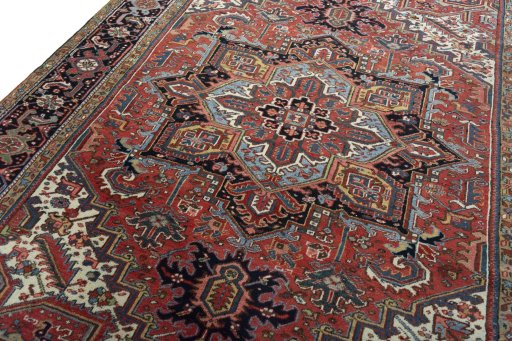 Backside of handmade 1930s Heriz rug showing knot structure and weave density