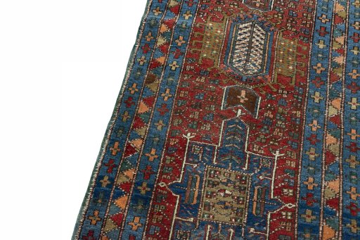 Backside of handmade 1930s Heriz rug showing knot structure and weave density