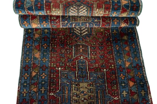 Full view of 1930s Heriz rug from Iran / Persia, 446 × 92 cm in Red tones
