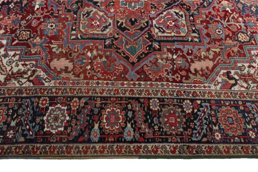 Corner detail of 1930s Heriz rug showing border pattern and Wool pile