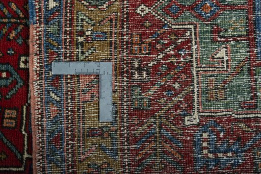 Surface texture of 1930s Heriz rug with natural Wool and intricate pattern