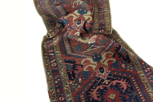 Corner detail of 1930s Heriz rug showing border pattern and Wool pile