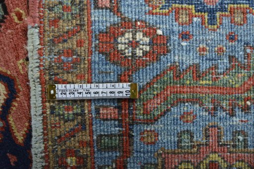 Backside of handmade 1930s Heriz rug showing knot structure and weave density