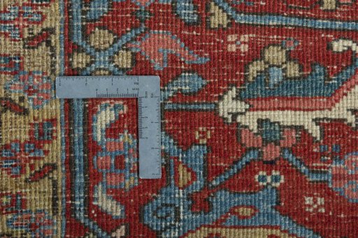 Backside of handmade 1930s Heriz rug showing knot structure and weave density
