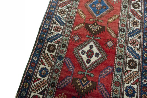 Backside of handmade 1950s Heriz rug showing knot structure and weave density